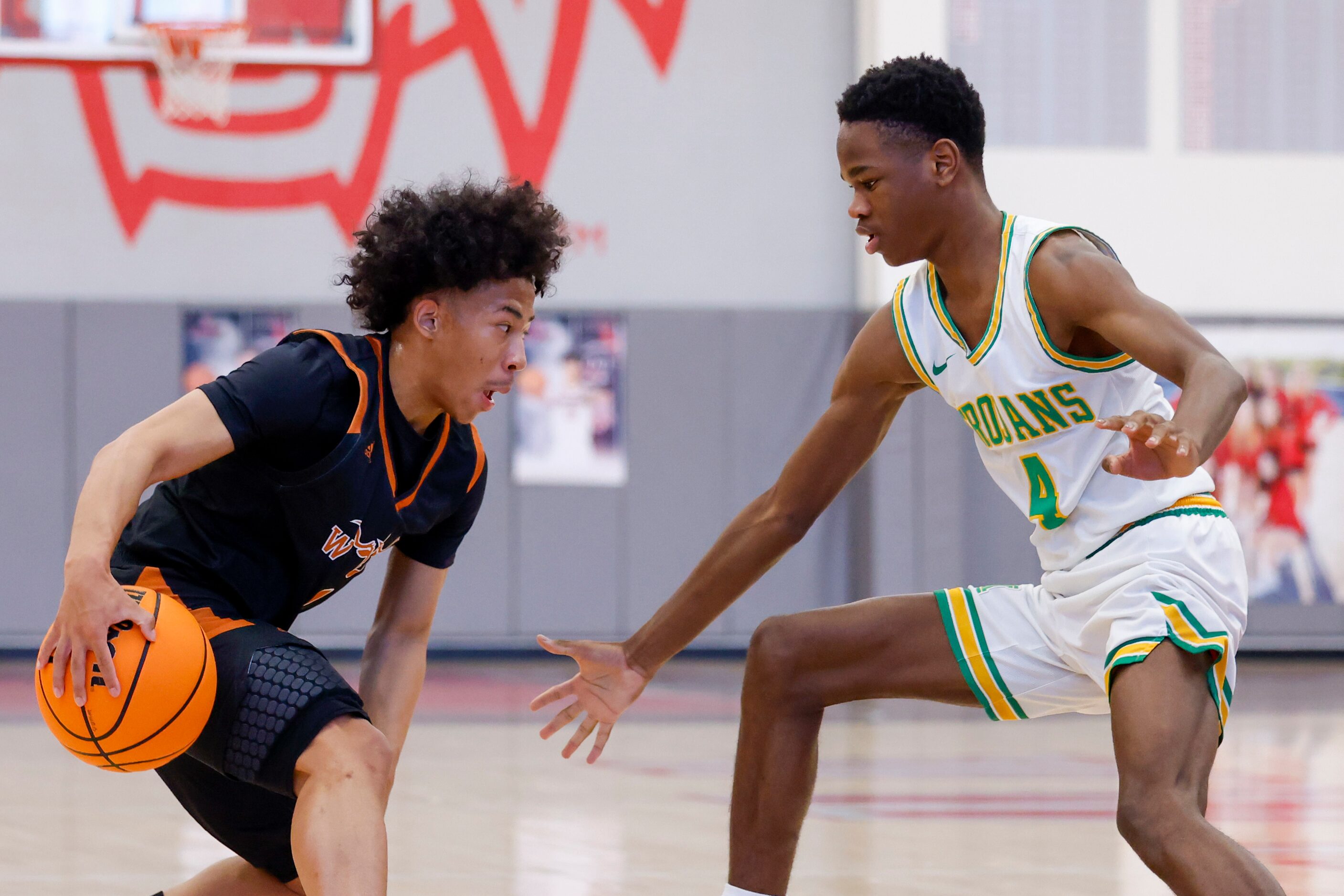 Madison guard Eric Bradix (4) defends against W.T. White guard Louis Conner (1) during the...