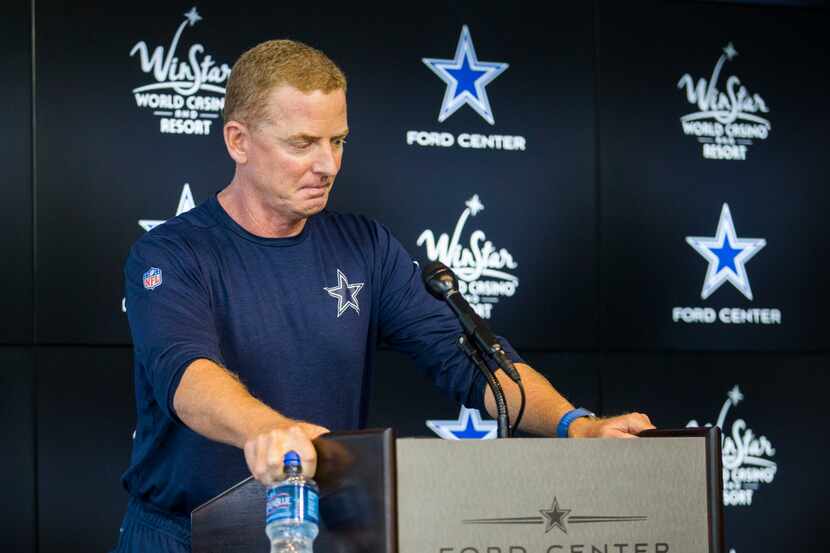 Dallas Cowboys head coach Jason Garrett gets emotional while making a brief statement about...