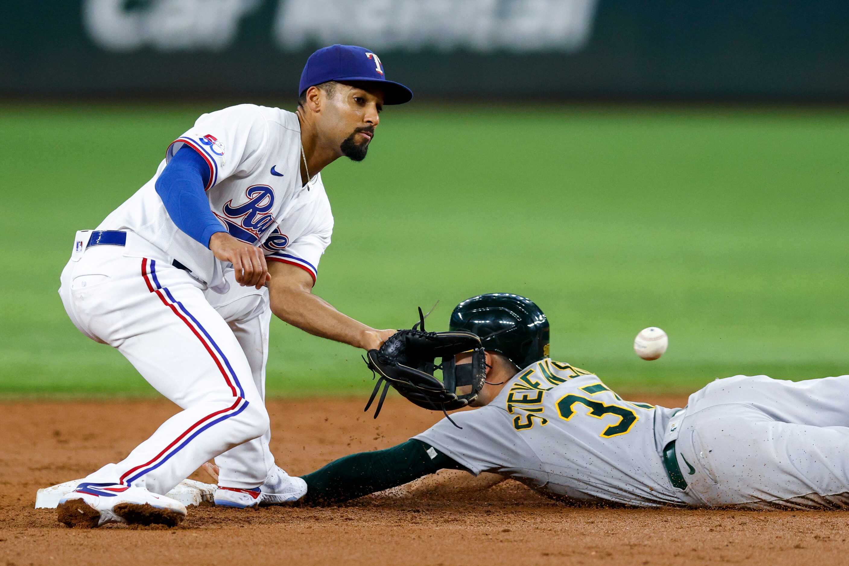 Oakland Athletics center fielder Cal Stevenson (37) safely steals second base as Texas...