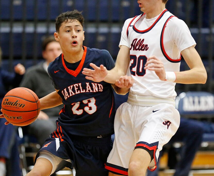 Wakeland gaurd Javante McCoy (23) drives to the basket while being defended by Allen forward...