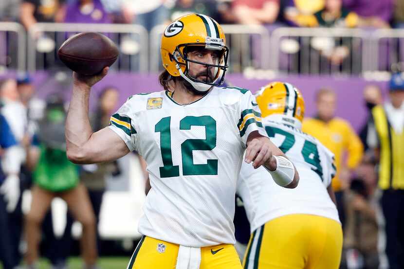 FILE -  Green Bay Packers quarterback Aaron Rodgers (12) throws a pass during the first half...