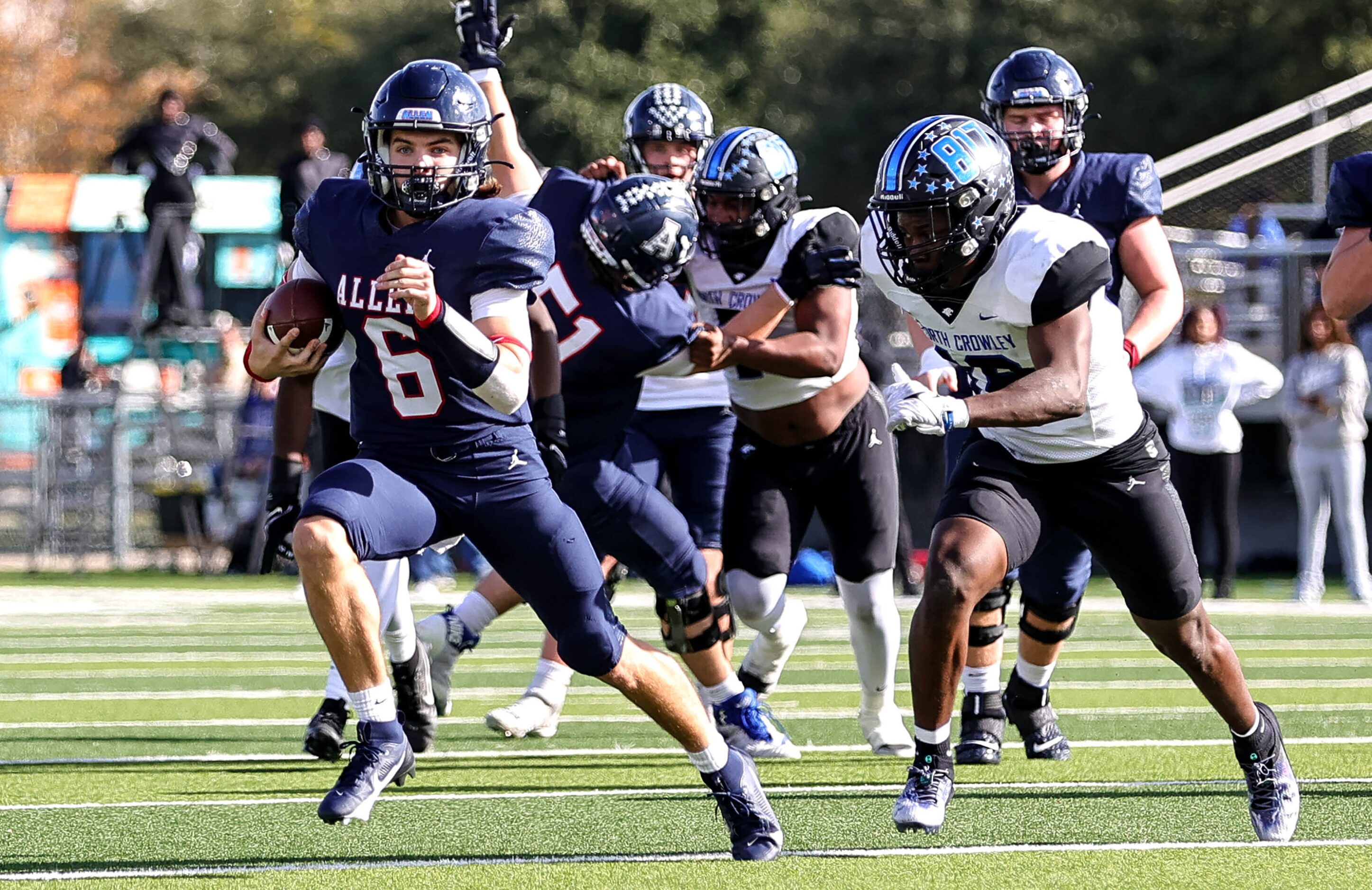 Allen quarterback Dylan Chapman (6) scrambles towards the goal line against North Crowley...