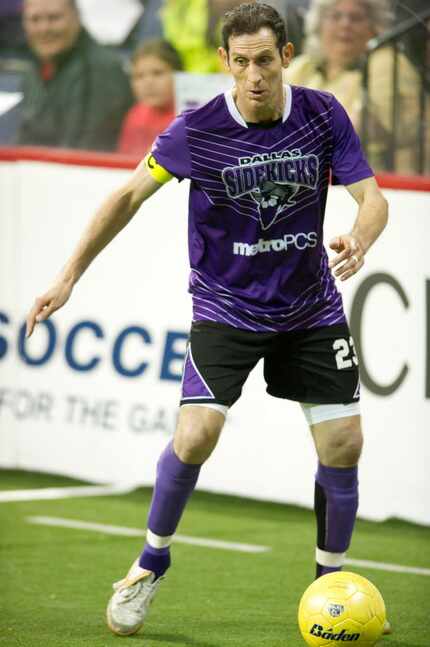 Nick Stavrou (23) of the Dallas Sidekicks brings the ball up the field against the Rockford...