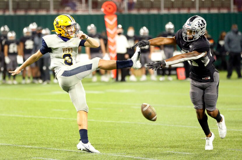 Arlington Lamar quarterback Cade Carlson (3) has his punt blocked by Arlington Martin's...