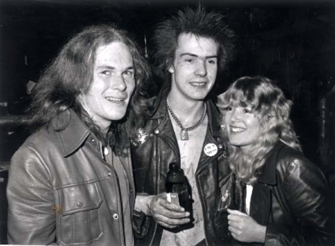 Sid Vicious flanked by Buddy magazine staffers Ben Ferguson (left) and Bobette Riner after...