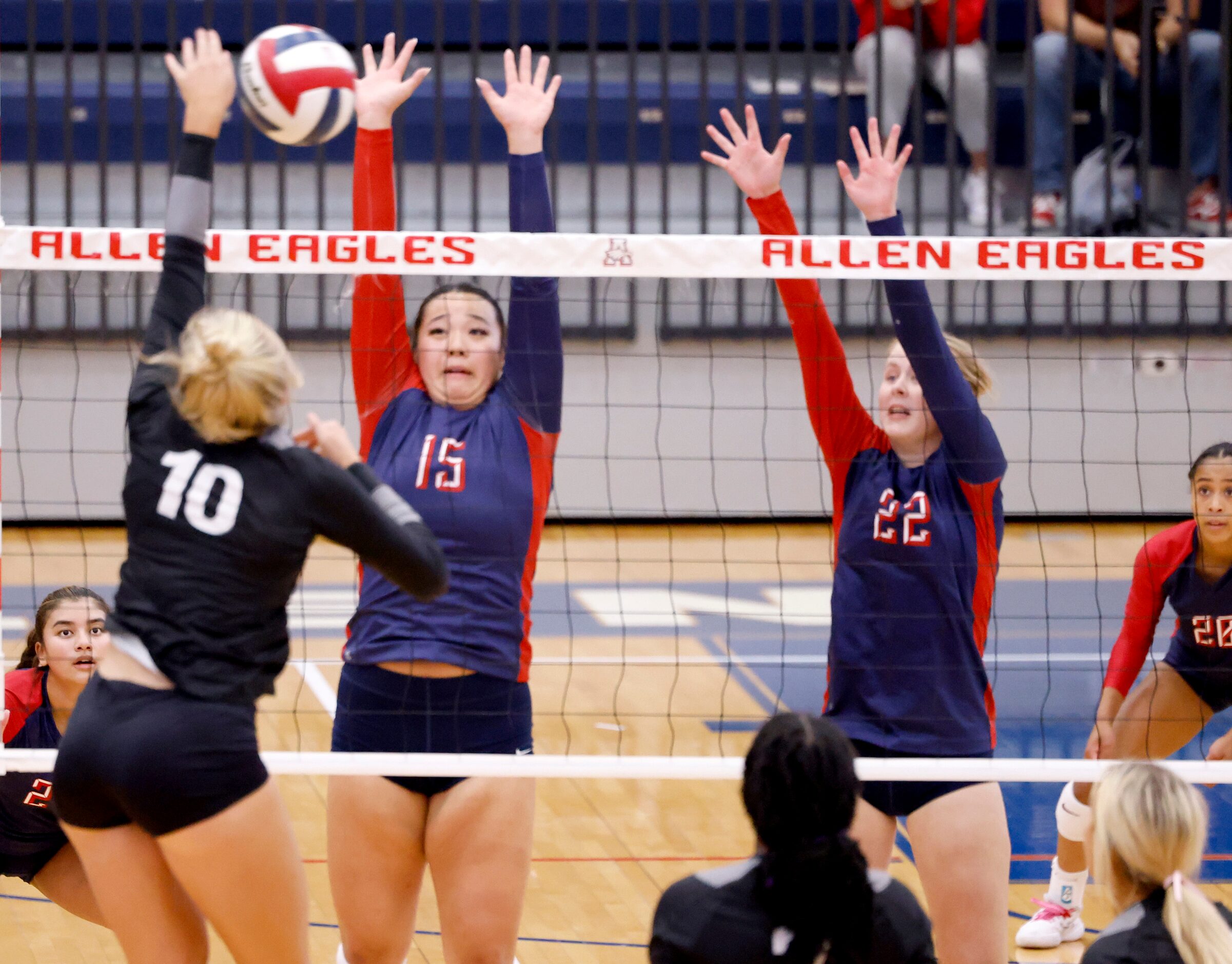 Denton Guyer junior Madelynn Hokanson (10) spikes the ball over the net toward Allen senior...