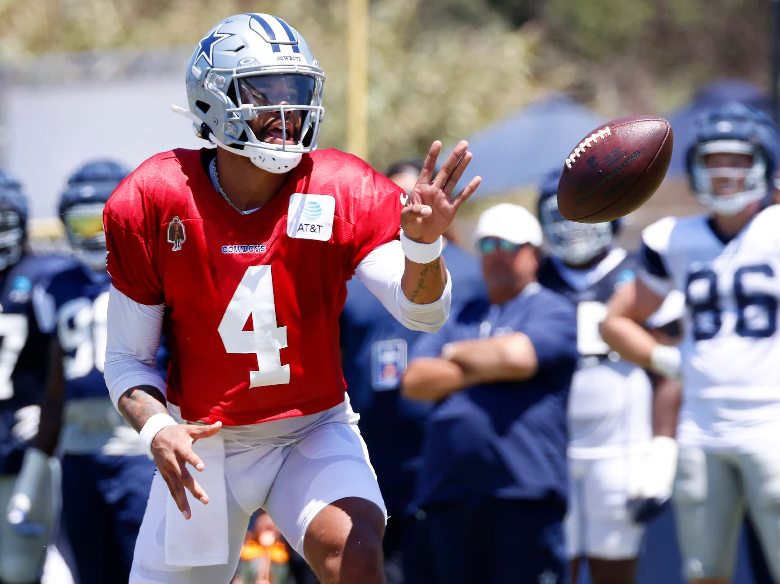 Dallas Cowboys quarterback Dak Prescott (4) pitches the ball as he escaped the pocket during...