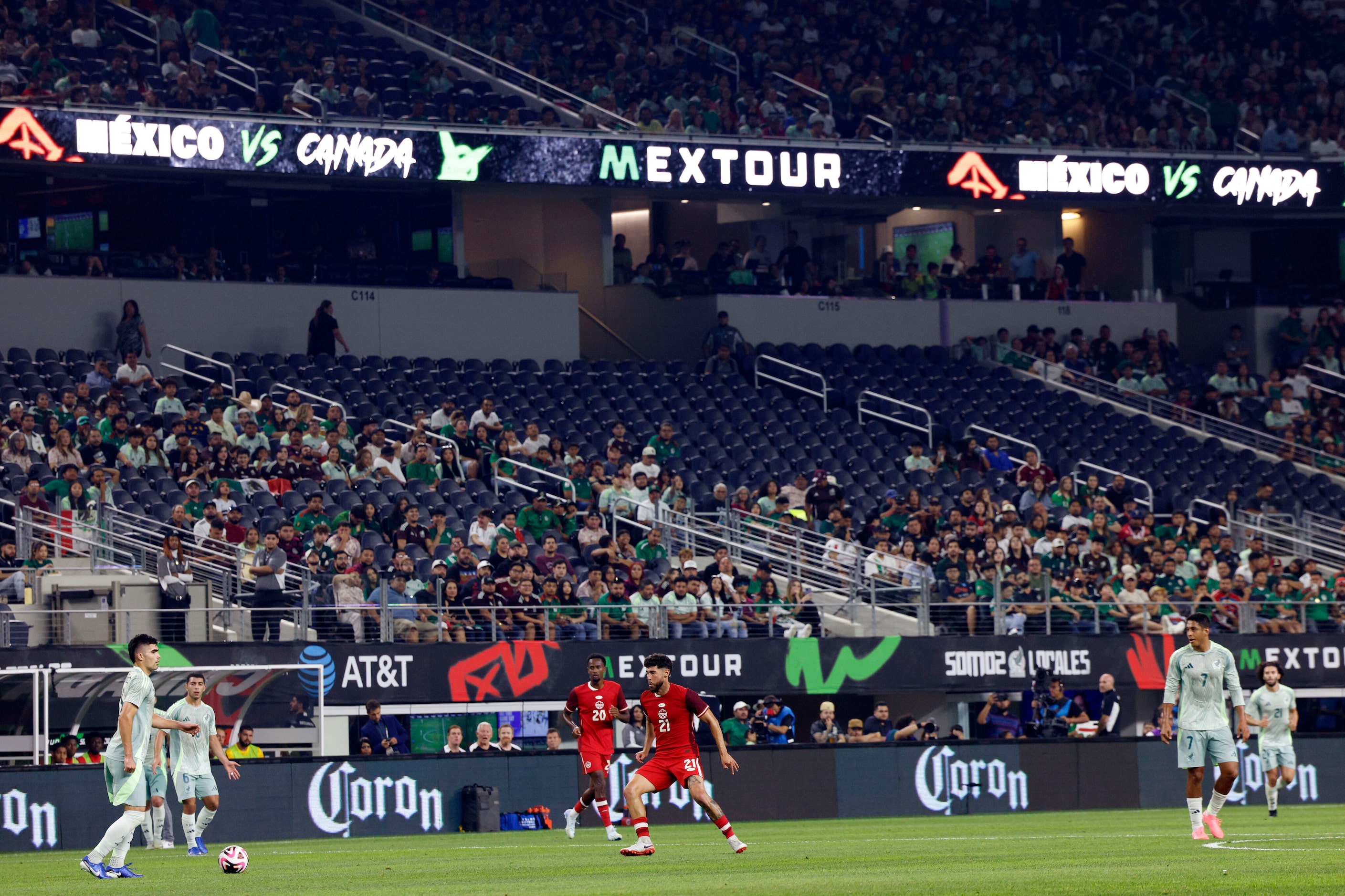 Mexico defenseman Johan Vasquez (5) dribbles the ball in front of a largely empty lower...