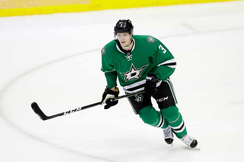 Dallas Stars' John Klingberg (3) of Sweden skates across the ice in the third period of an...