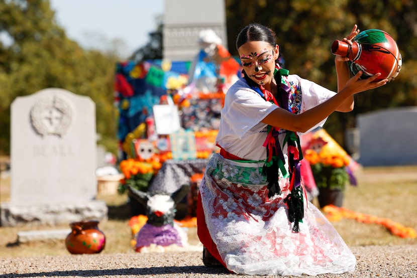 Yaretzi Flores performs with a cantoro during Day of the Dead celebration, on Saturday, Oct....