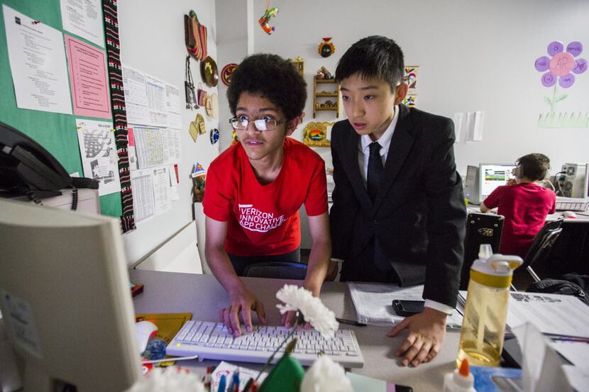 Rice Middle School students  Rishi Shridharan (left) and David Yue are part of a team that...