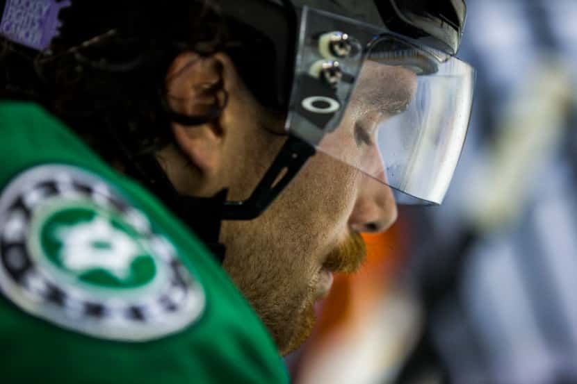 Dallas Stars defenseman Stephen Johns (28) pauses at the bench during the second period of...