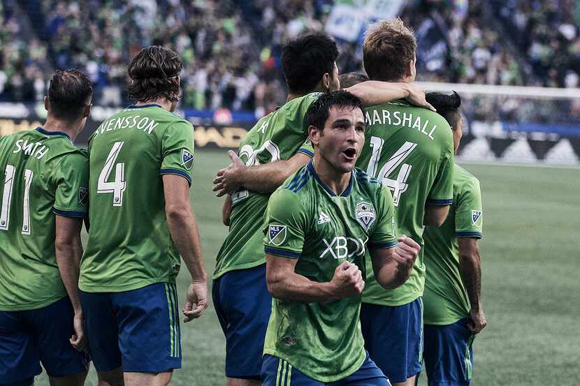 Nicolás Lodeiro celebrates with his teammates after scoring the game-winning goal against FC...