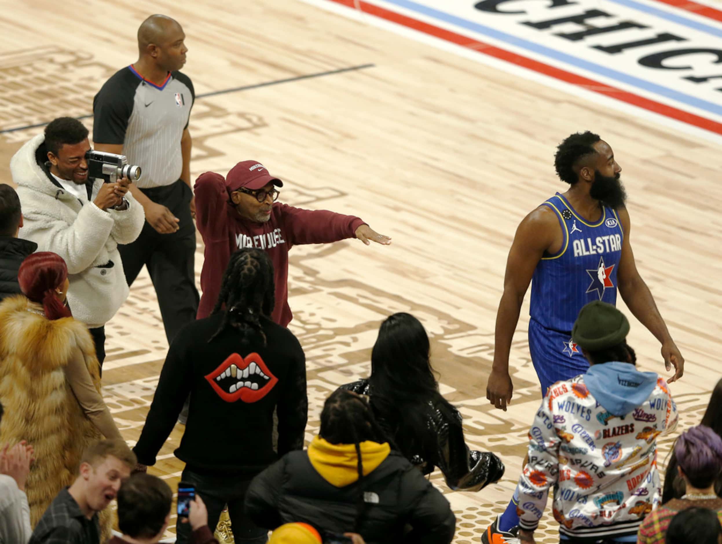 Team LeBron's James Harden (2) is heckled by Spike Lee after he was called for a charging...
