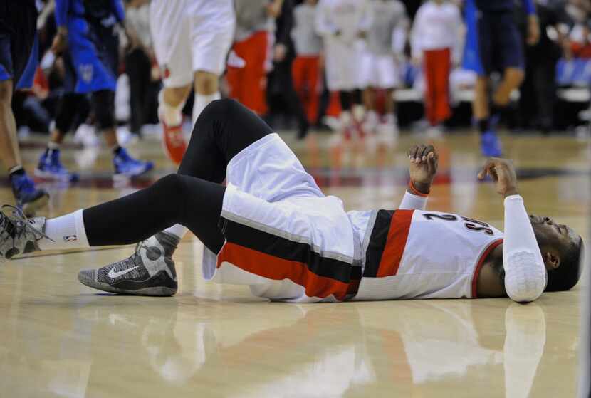 Wesley Matthews after injuring his left Achilles against the Dallas Mavericks during the...