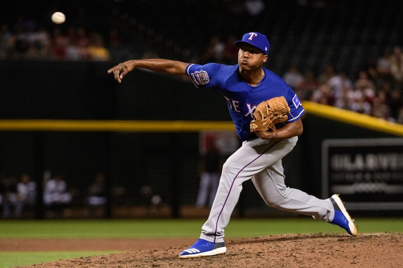 PHOENIX, ARIZONA - APRIL 09: Jose Leclerc #25 of the Texas Rangers delivers a pitch in the...