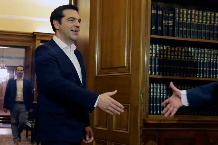 Greece's Prime Minister Alexis Tsipras arrives to meet Greek President Prokopis Pavlopoulos...