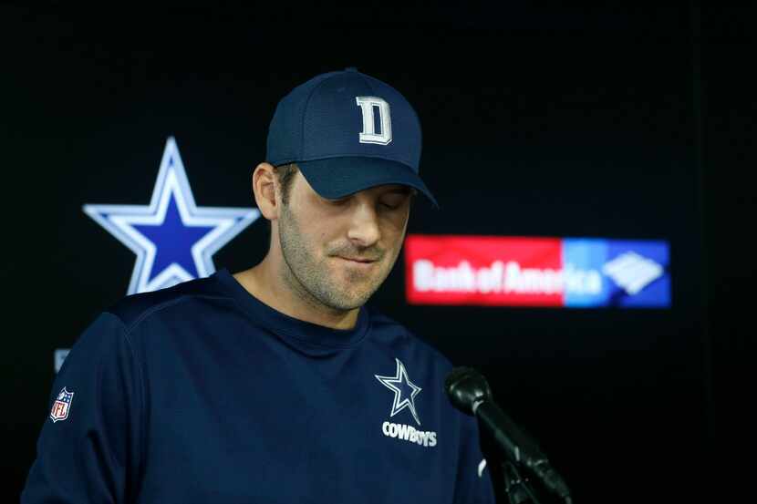 Dallas Cowboys quarterback Tony Romo pauses while reading his statement during a press...