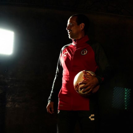 Oscar Pareja poses for photos in a Club Tijuana track suit top. (12/7/18)