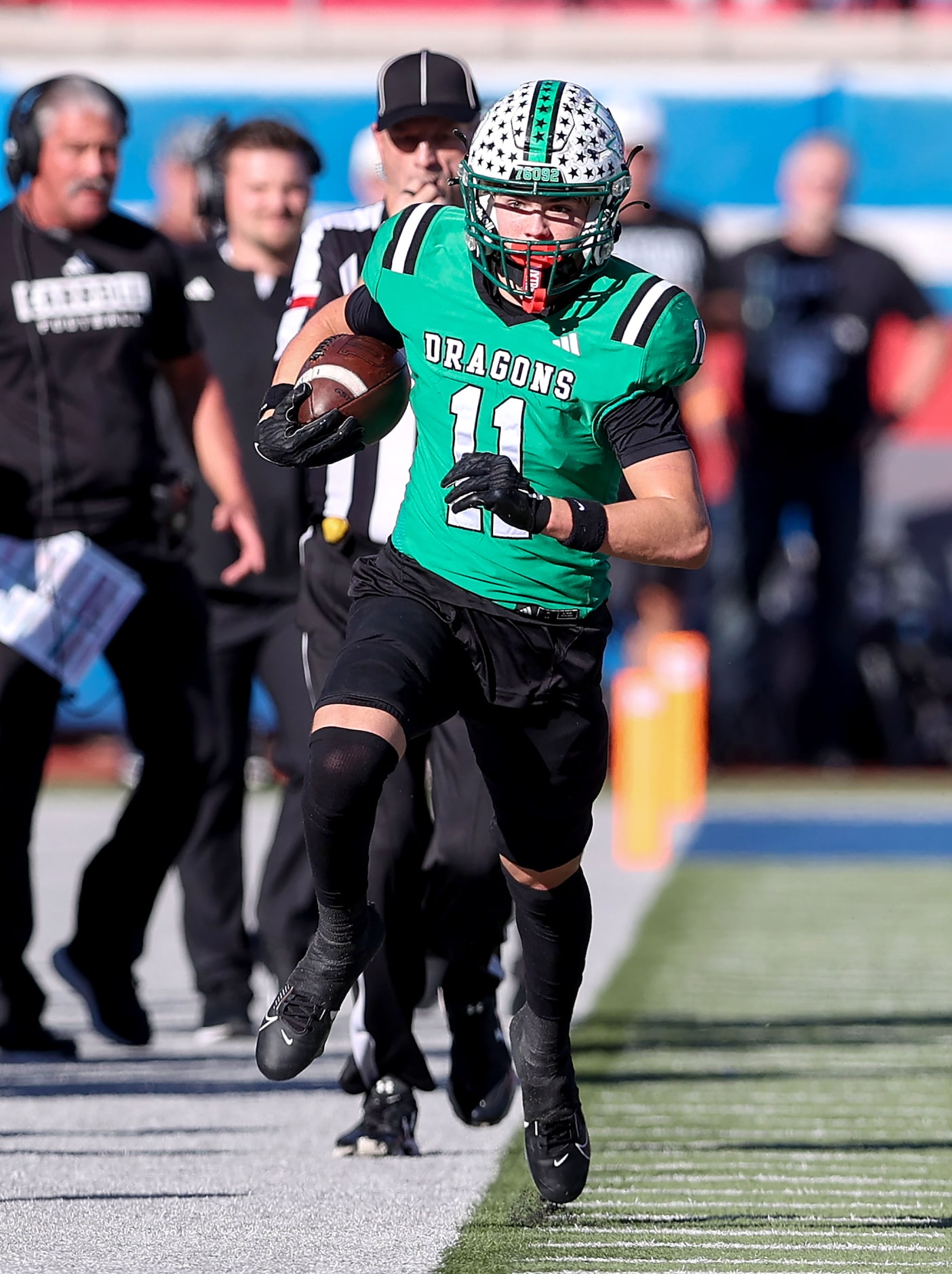 Southlake Carroll wide receiver Brock Boyd (11) tip toes the sideline after making a...