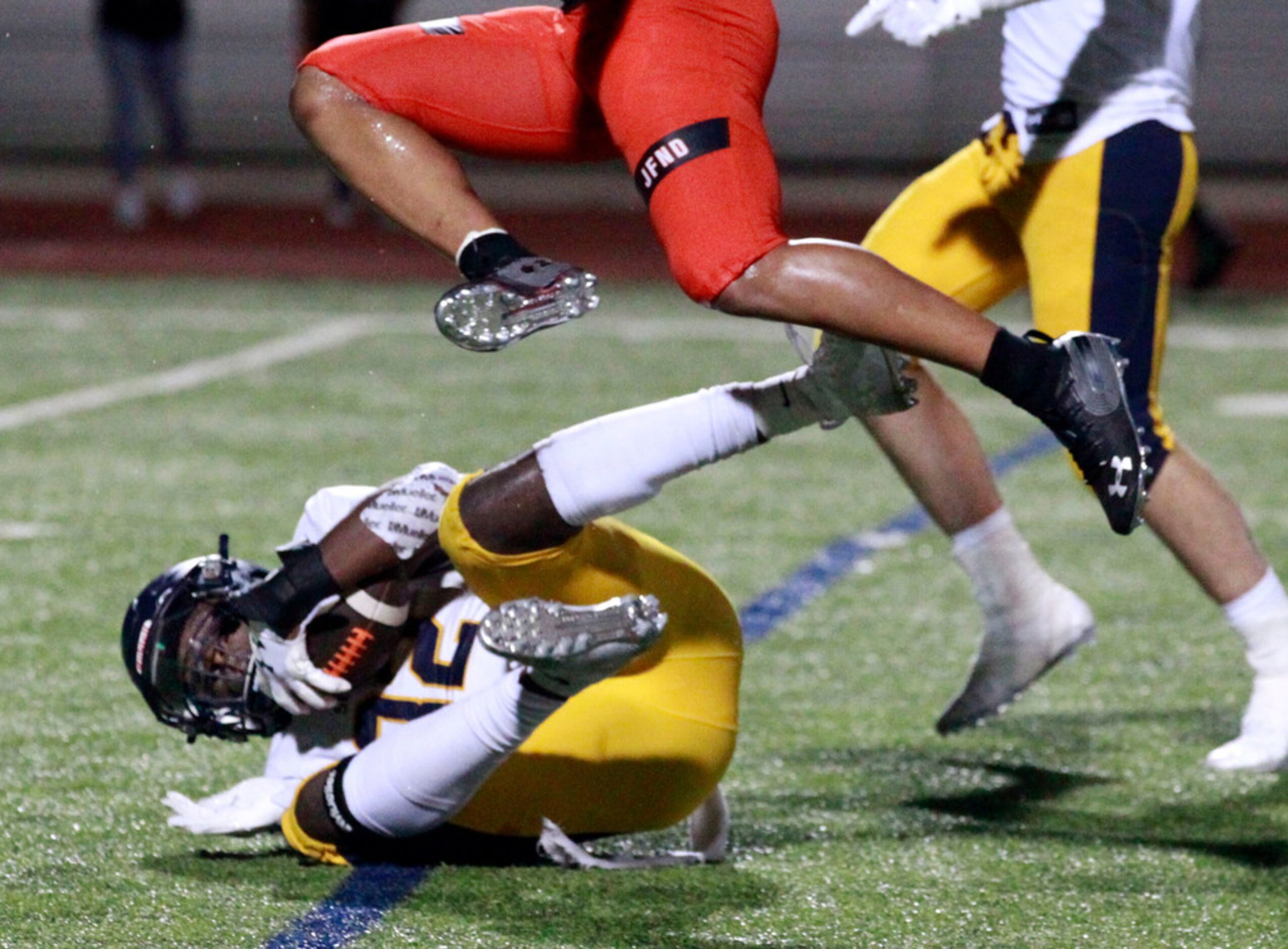 Highland Park defender Prince Dorbah (32) grabs an interception late in the fourth quarter...