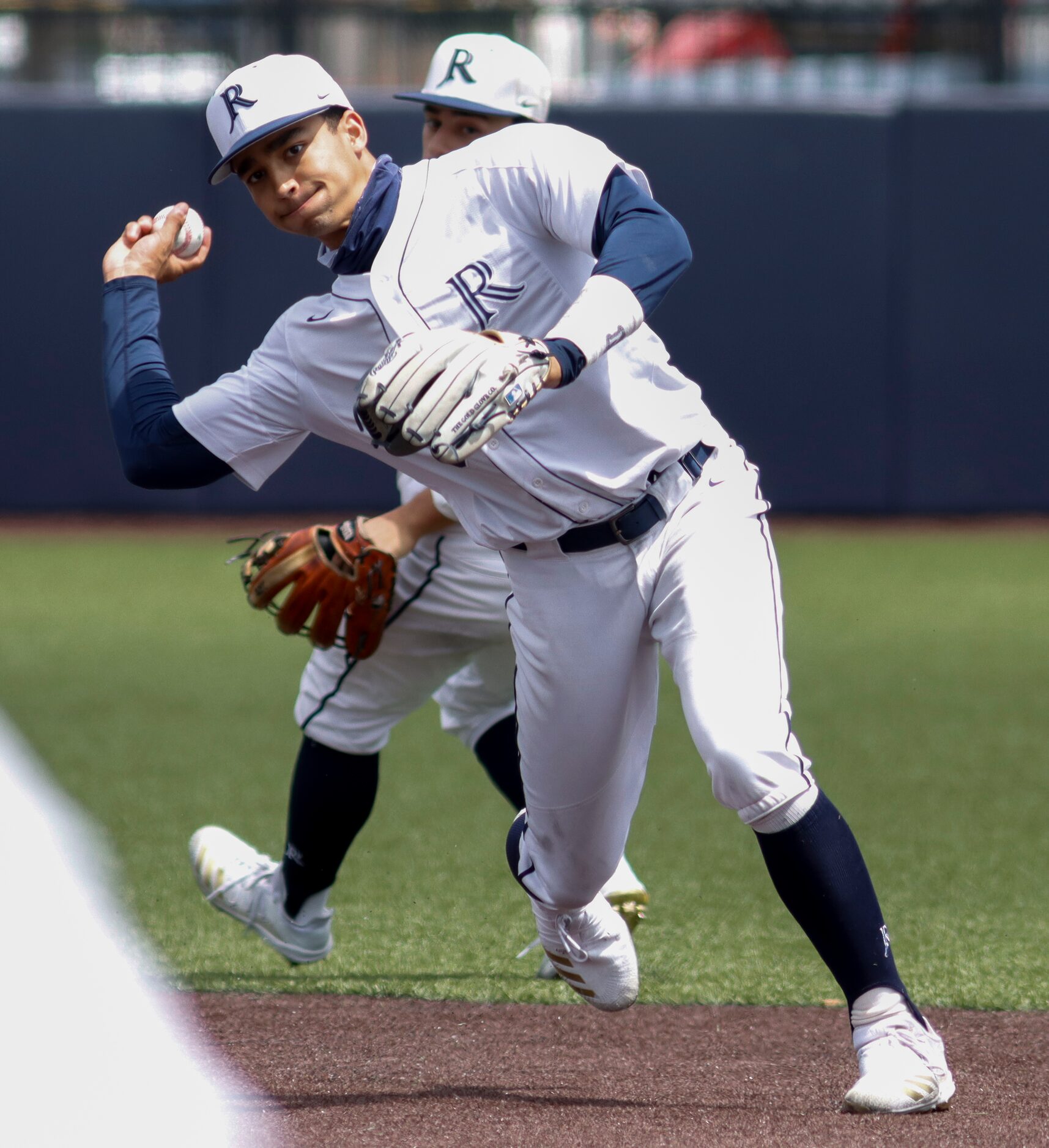 Jesuit shortstop Jordan Lawlar throws to first for an out during a district 7-6A game...