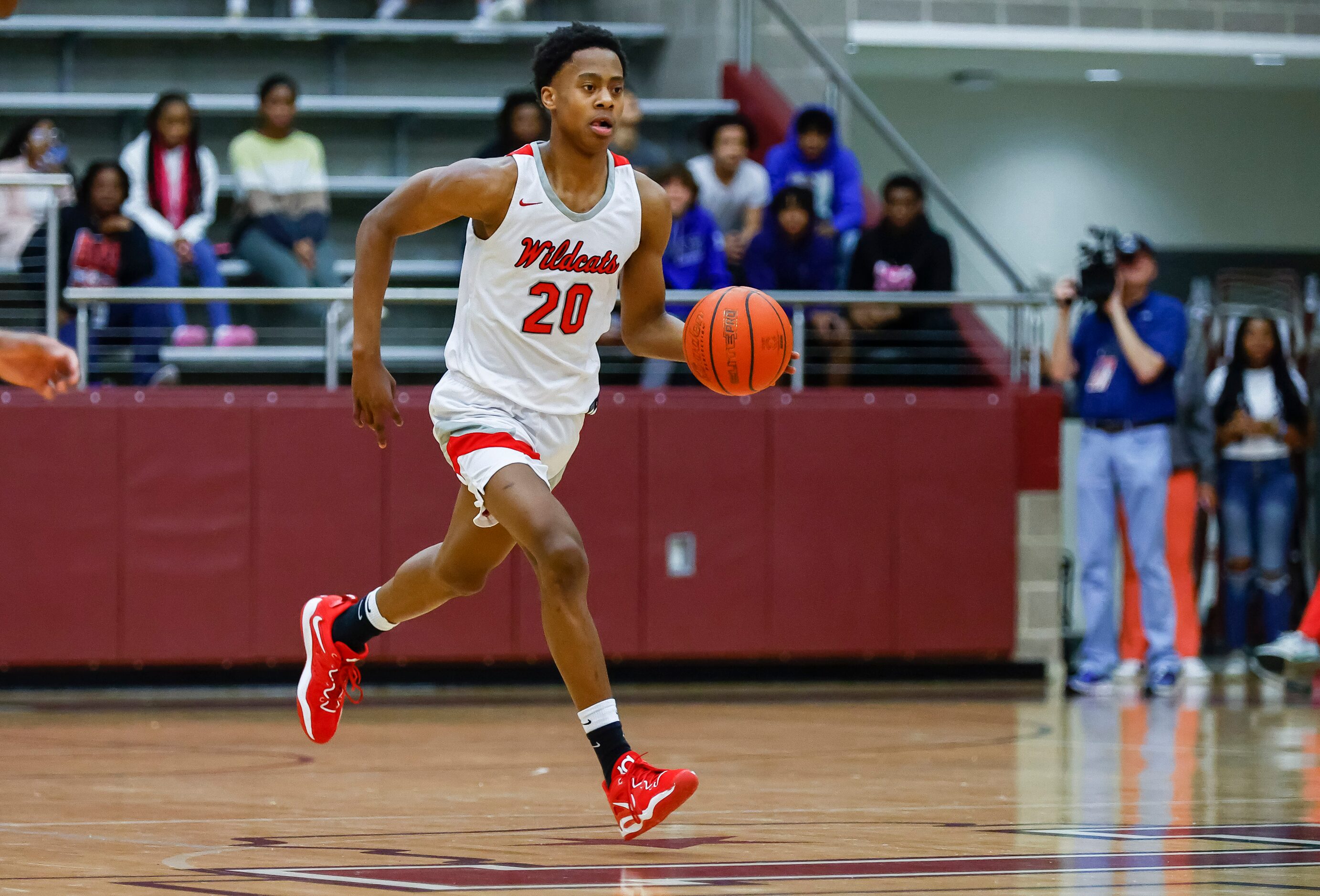 Lake Highlands junior guard Tre Johnson looks for room against the Arlington Bowie defense...