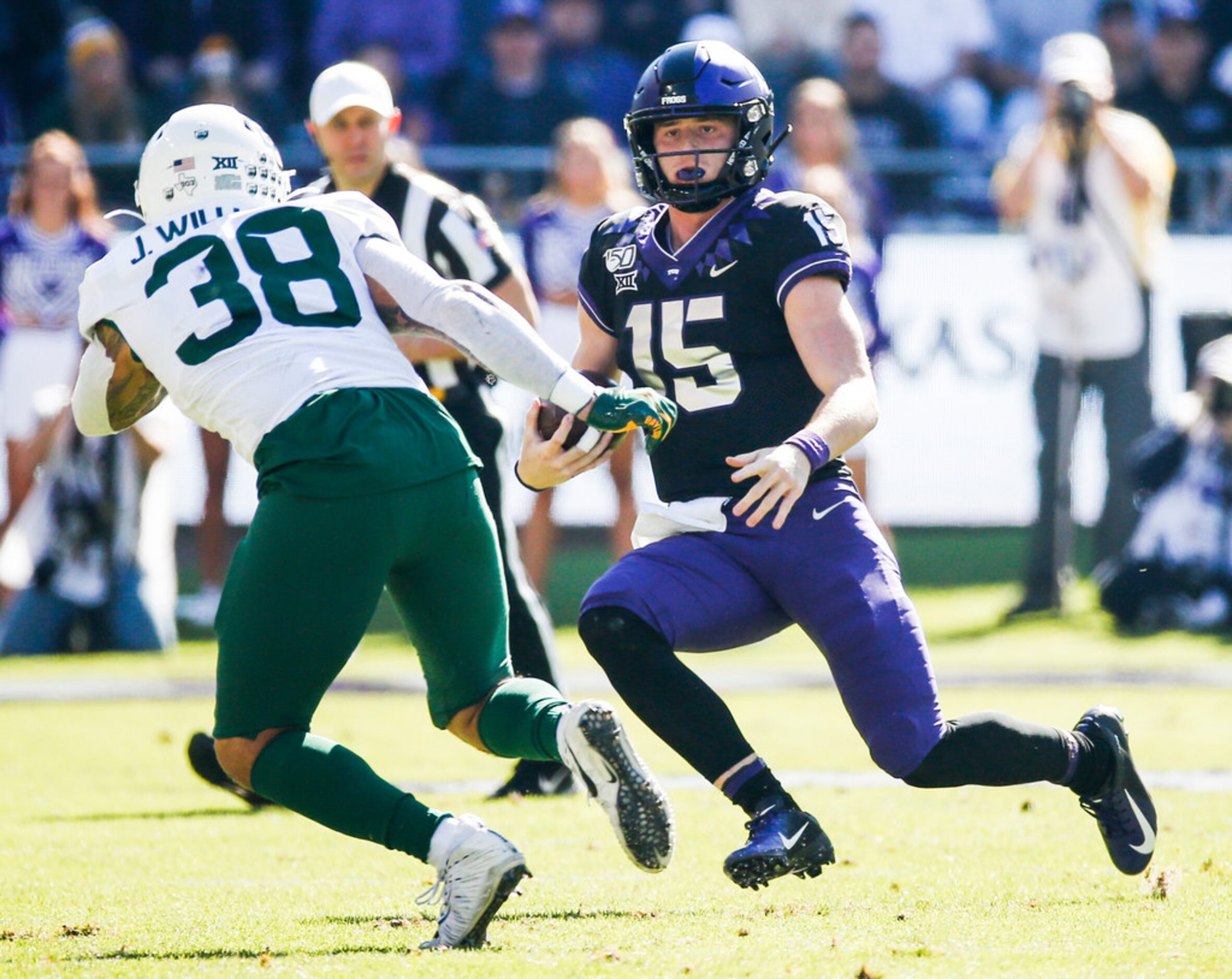 TCU Horned Frogs quarterback Max Duggan (15) looks to evade Baylor Bears linebacker Jordan...