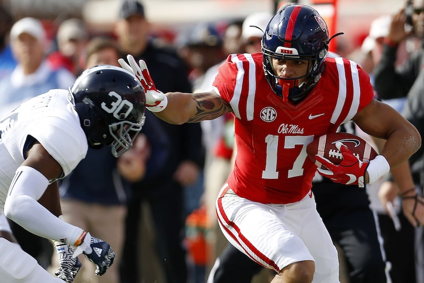 OXFORD, MS - NOVEMBER 05: Evan Engram #17 of the Mississippi Rebels runs with the ball as...