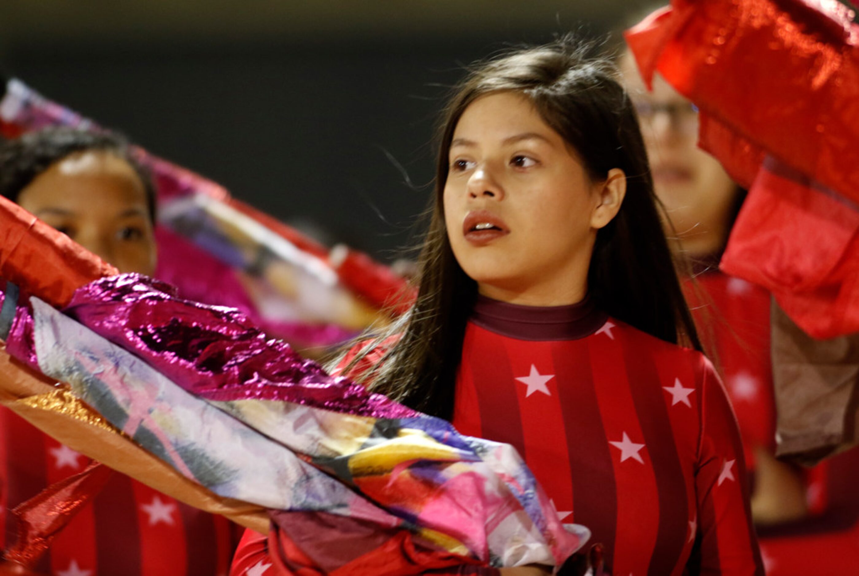 members of the Duncanville Panthers color guard line up in preparation for their performance...