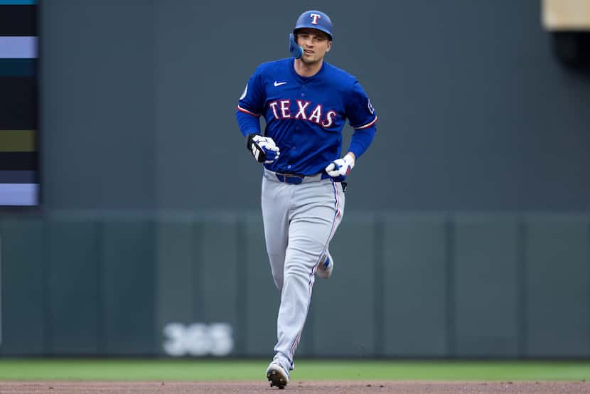 Texas Rangers' Corey Seager runs the bases after hitting a two-run home run against the...