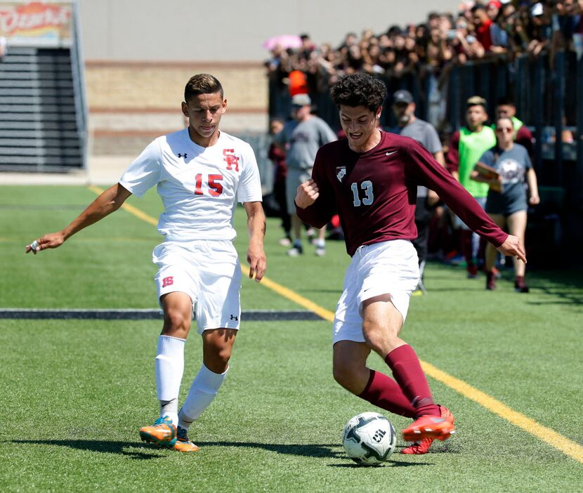 Sam Houston player Jose Ortiz (15) battles with Lewisville player Carlos Galvan (13) during...