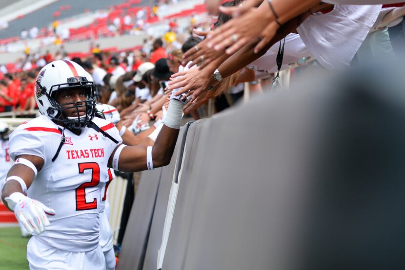 LUBBOCK, TX - SEPTEMBER 12: The Texas Tech Red Raiders interact with fans prior to the game...