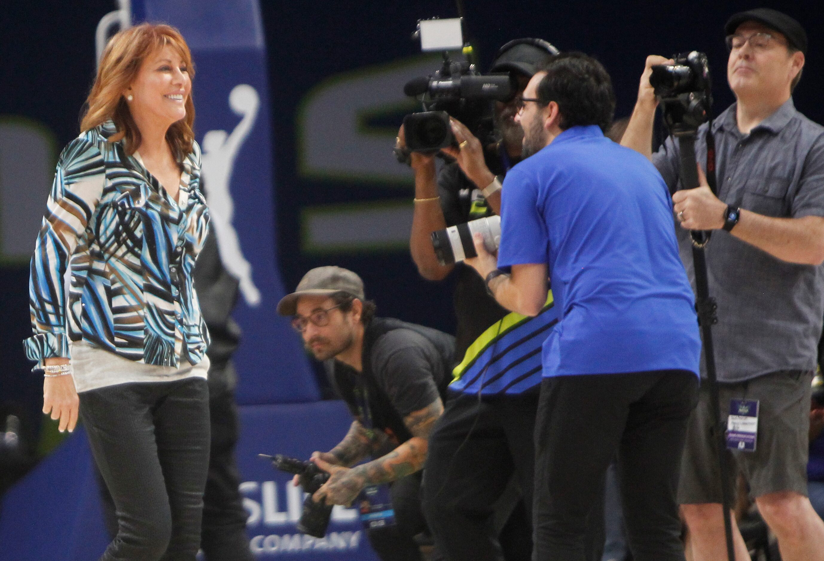 Nancy Lieberman beams as fans respond at her name announced as she joined other "Legends of...