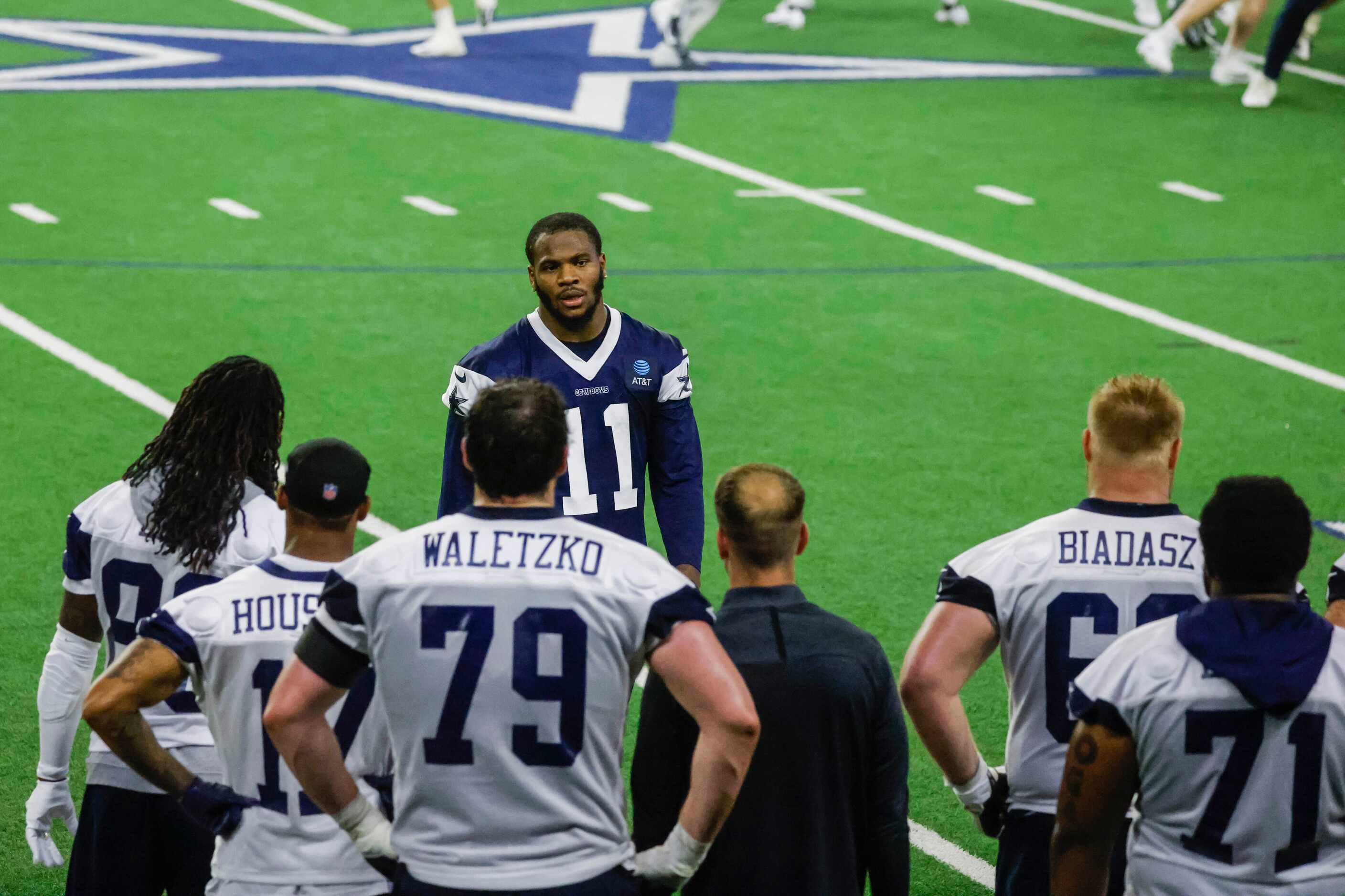 Dallas Cowboys linebacker Micah Parsons leaves the field during timeout in a OTA practice on...