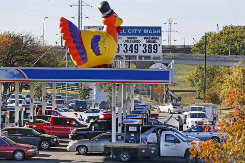 Motorists stop to fuel up for the Thanksgiving holiday at Fuel City south of downtown Dallas...