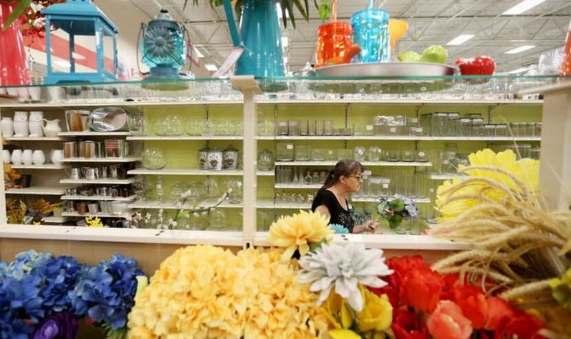 
Deb Cummings of Dallas  shops for artificial floral arrangements at a Michaels store in...