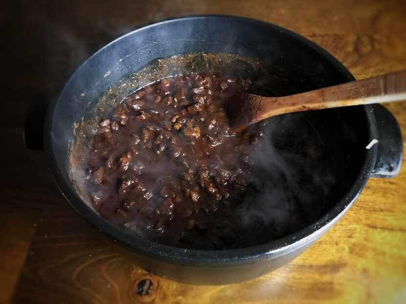 A slow simmer over a couple of hours turns beef, ancho chile paste and other spices into a...