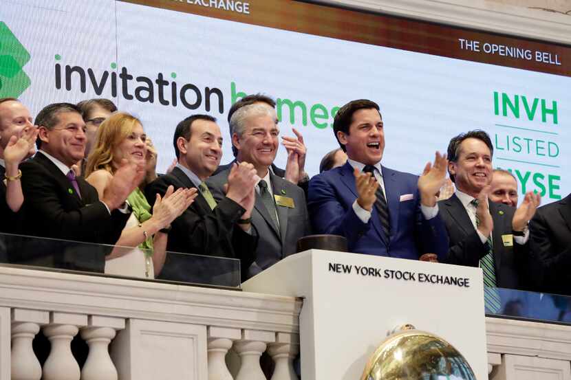 Invitation Homes executives celebrated as they rang the New York Stock Exchange opening bell...