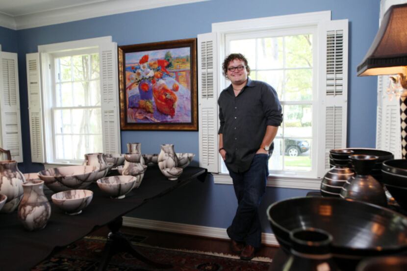 Graduate student Brooks Oliver sells his pottery at an annual sale he hosts at his parents'...