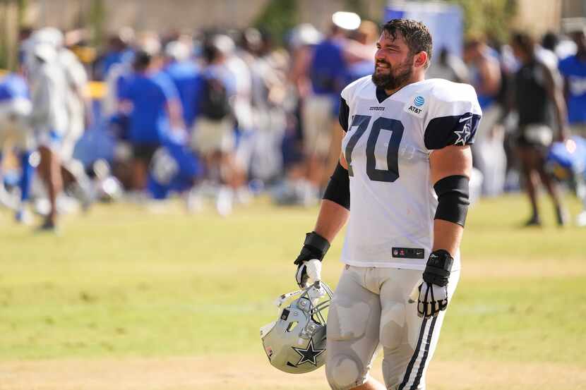 Dallas Cowboys guard Zack Martin (70) leaves the field following a joint practice with the...