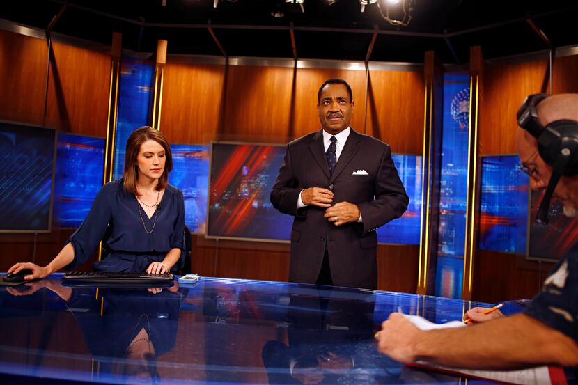 Anchors Shelly Slater and John McCaa prepares for the 5 p.m. newscast in  June 2013.