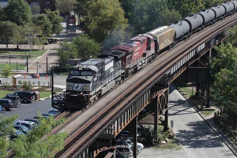 
Norfolk Southern and Canadian Pacific locomotives pulled a line of cars through Richmond,...