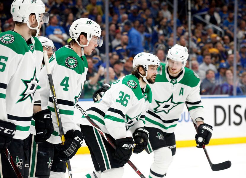 Stars center Mats Zuccarello (36) is congratulated by teammates after scoring a first period...