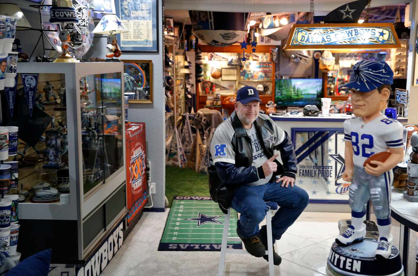 Dallas Cowboys fan Stoney Kersh poses for a portrait in his house in Arlington on Wednesday,...