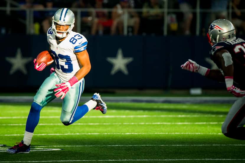 Dallas Cowboys wide receiver Terrance Williams (83) tries to get past New England Patriots...