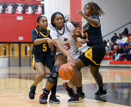 Frisco Liberty’s Jacy Abii (3) is double teamed by  Frisco Memorial’s Sydney Murphy (5) and...