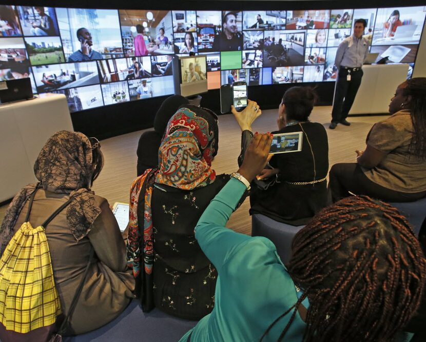 In 2014, Women from Afghanistan and Rwanda listened to a presentation as part of the Peace...