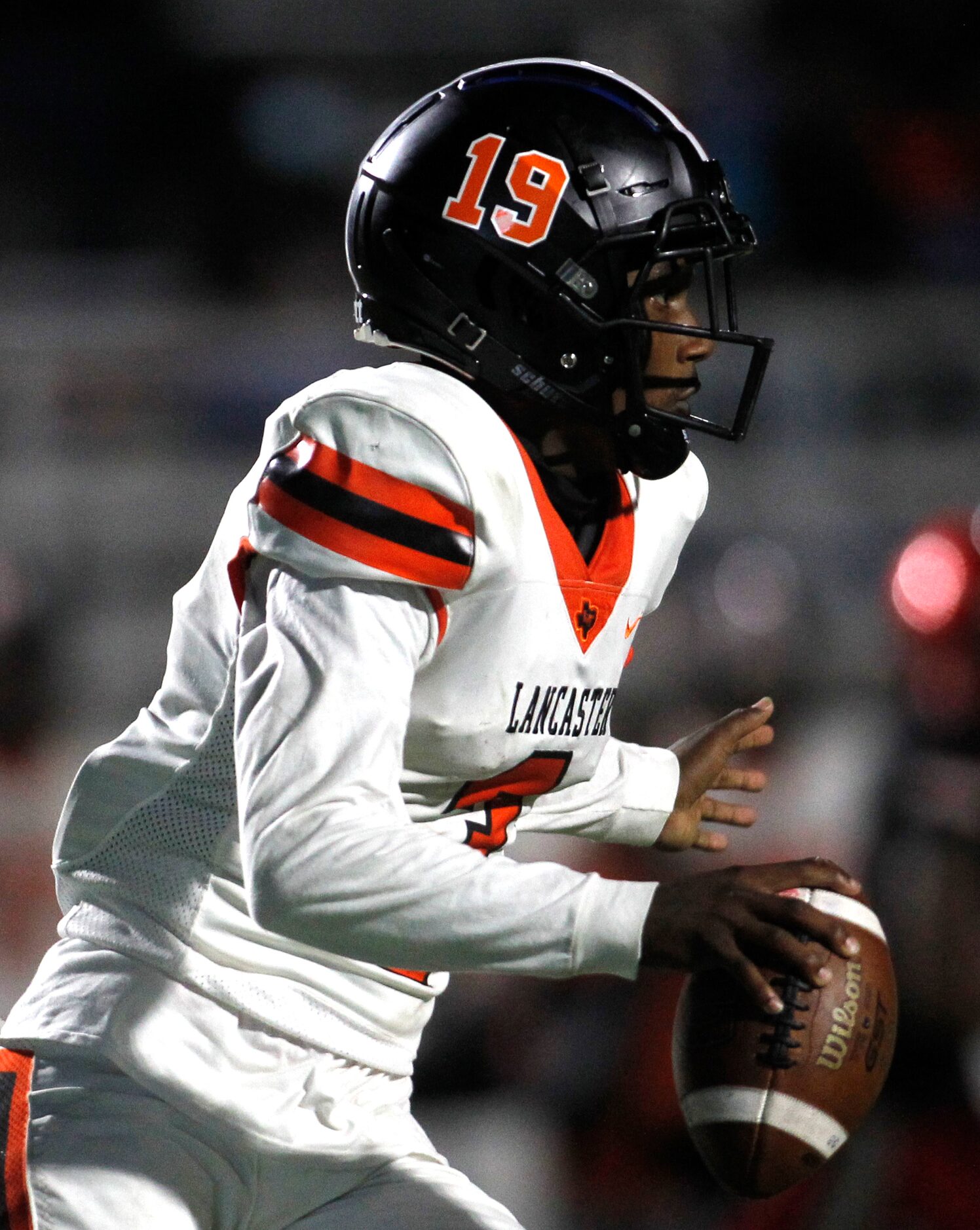 Lancaster quarterback Glenn Rice (3) looks for a receiver during 2nd quarter action against...