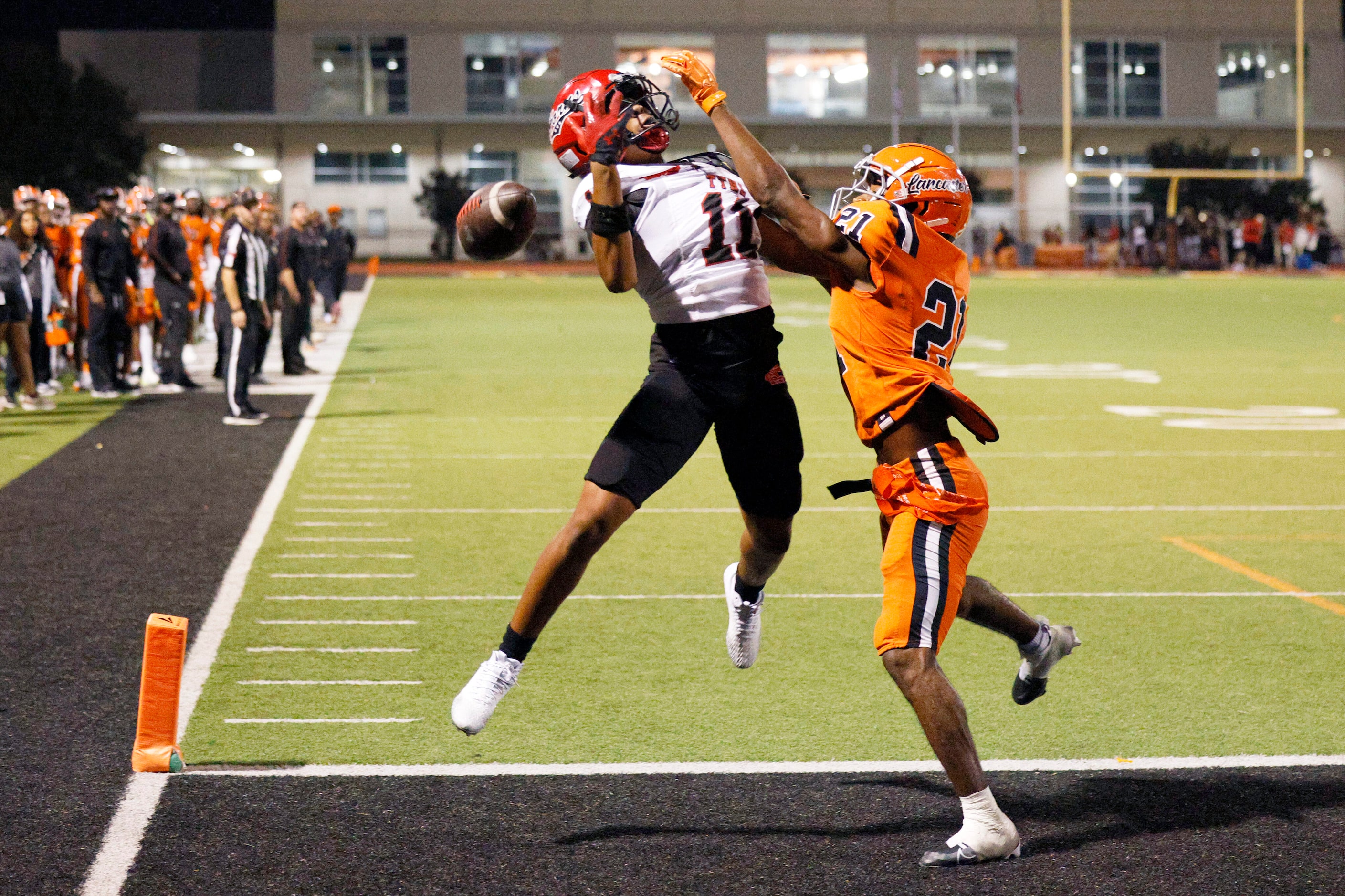 Lancaster defensive back Messiah Boulieu (21) breaks up a pass intended for Cedar Hill wide...